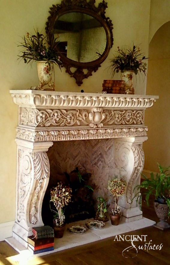 Ancient Surfaces ornately carved reclaimed limestone fireplace mantel with acanthus scroll corbels