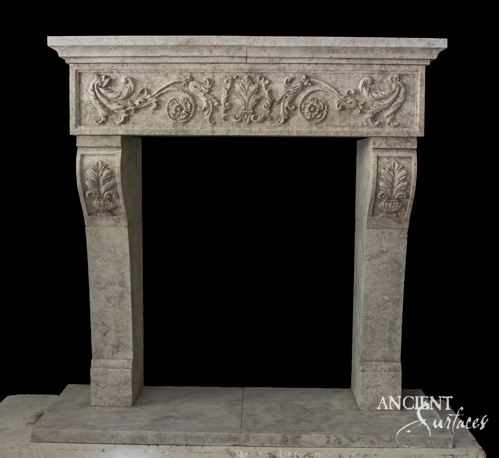 Reclaimed antique limestone fireplace mantel from Ancient Surfaces with a foliate scroll frieze and carved acanthus corbels