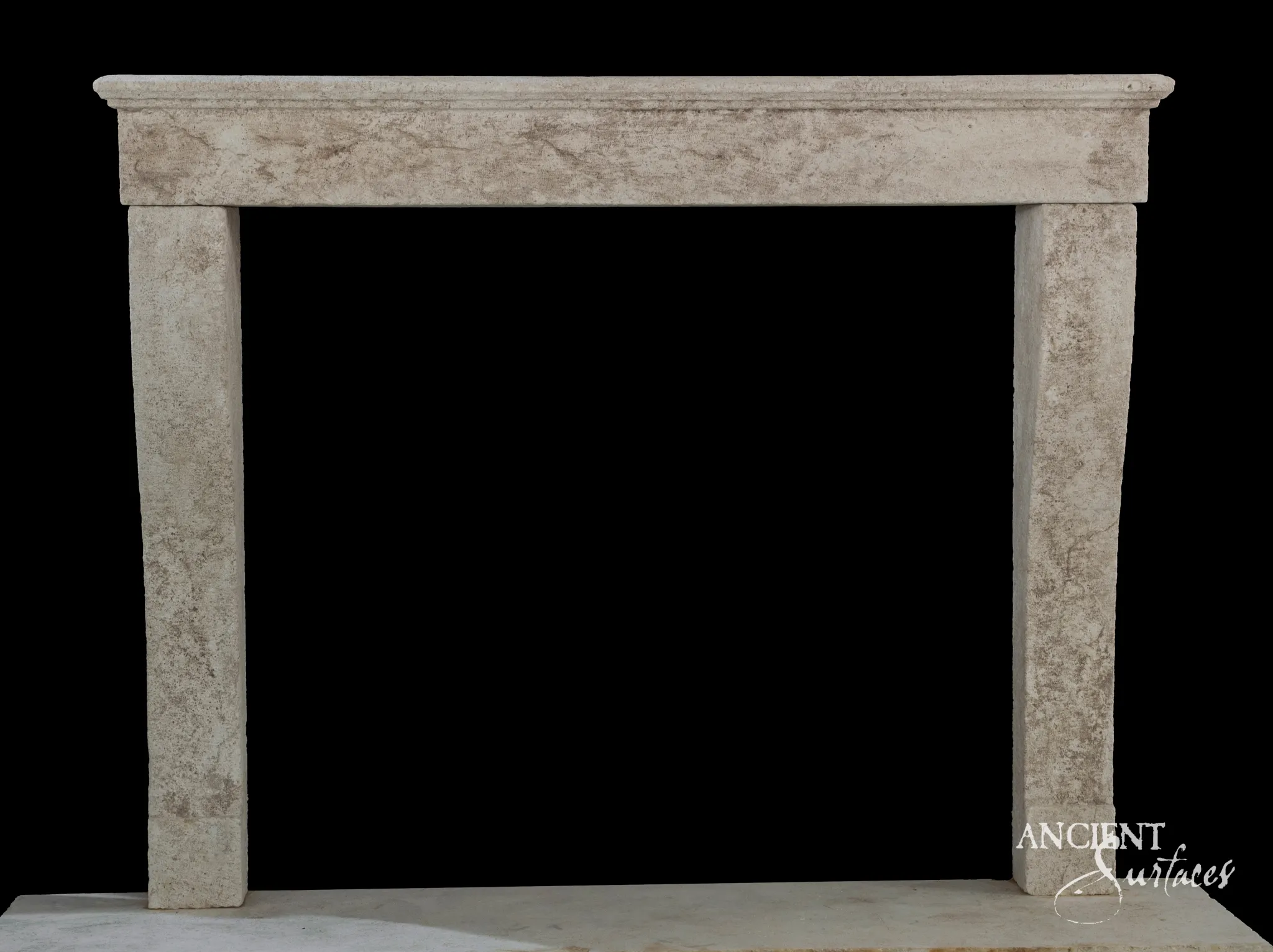 Plain reclaimed antique limestone fireplace mantel from Ancient Surfaces with a moulded shelf and slender tapered jambs